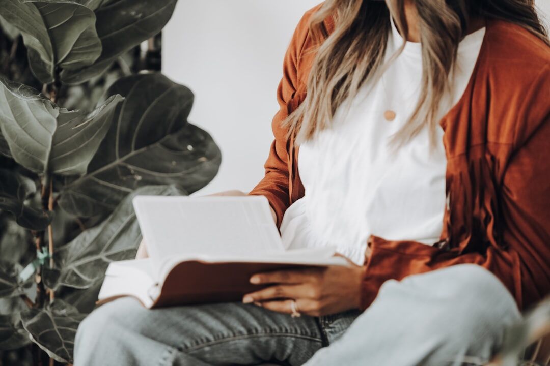 person reading self help book