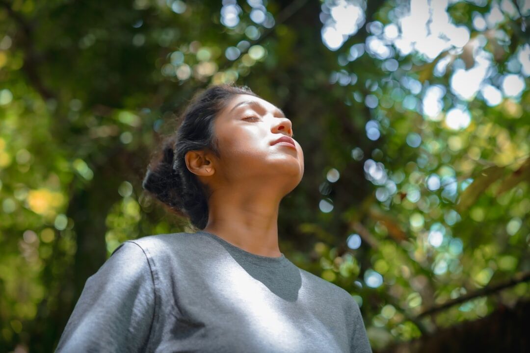 person practicing breathing exercises