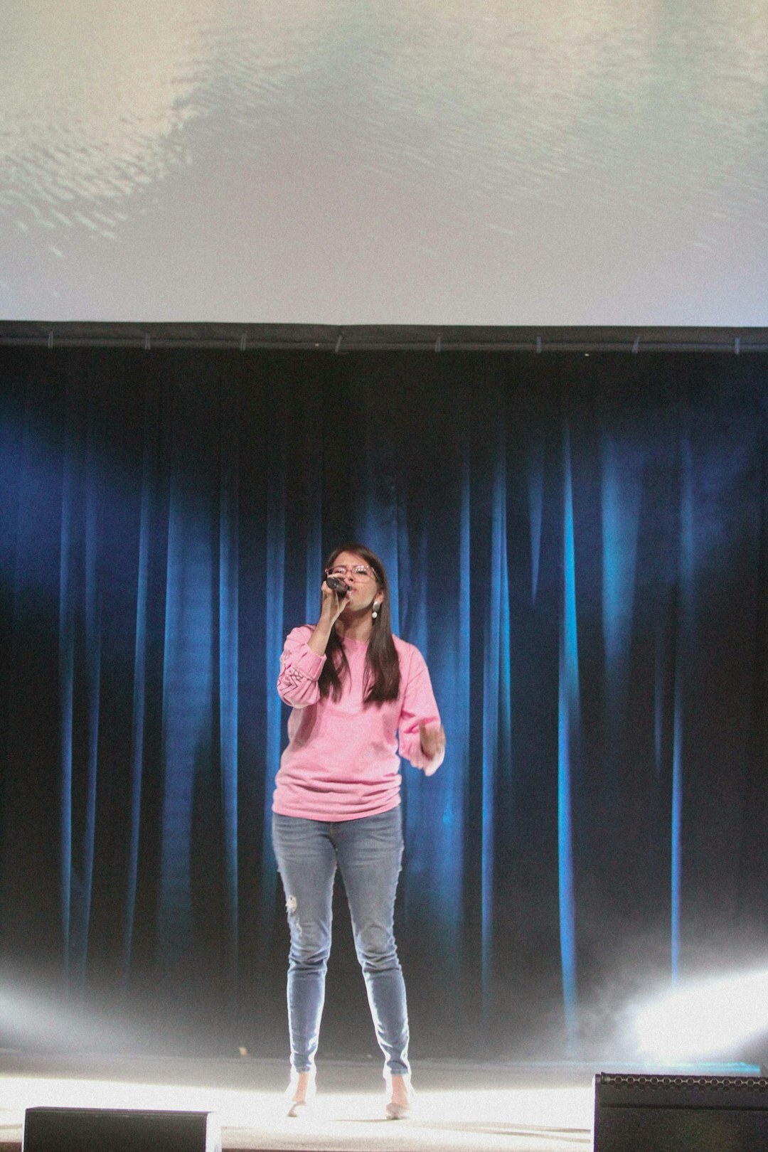 confident speaker on stage